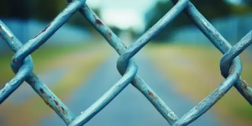 Blog wide Looking through fence at a site