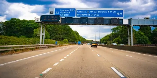 Blog Wide Motorway with blue signs and LED speed alerts