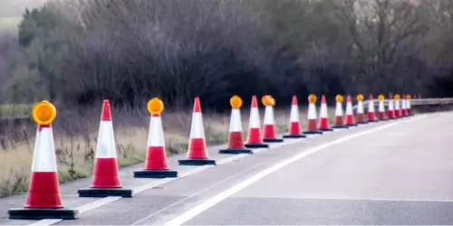 Blog Wide Traffic cones lined along the side of a high speed road