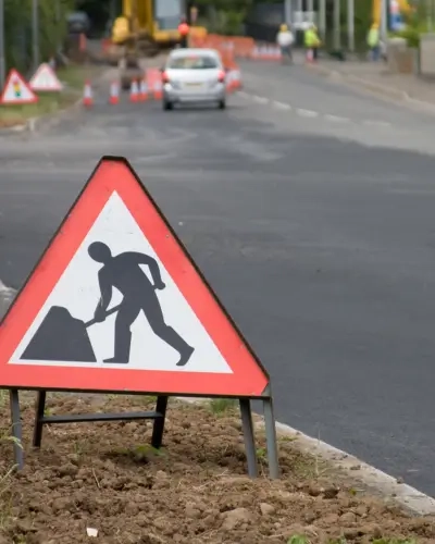 Blog Tall Roadworks with signs and workers