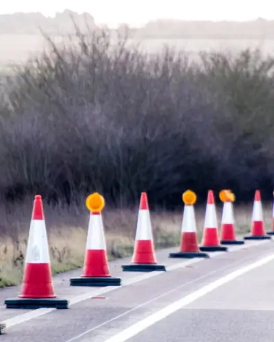 Blog Tall Traffic cones lined along the side of a high speed road