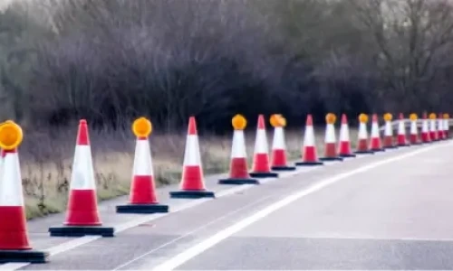 Blog Wide Traffic cones lined along the side of a high speed road