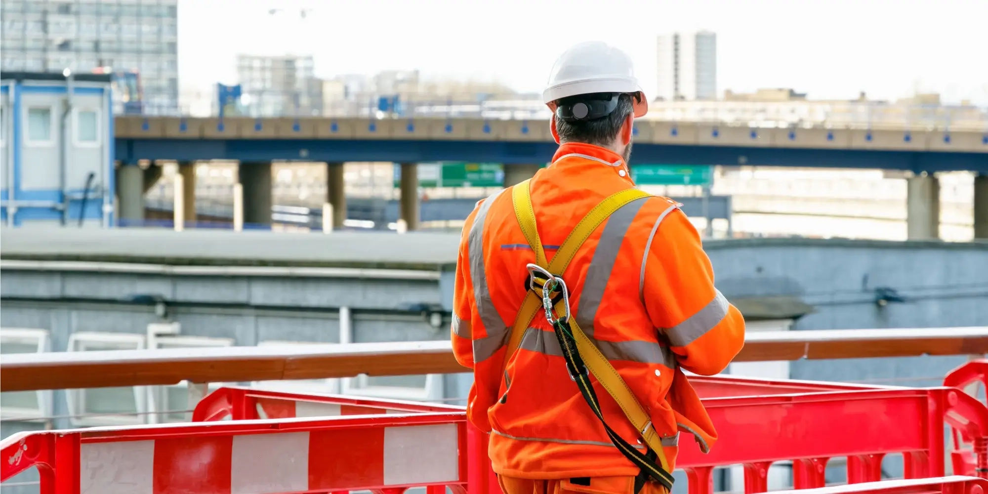 construction worker walking into a building site